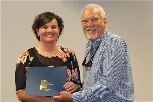 Natasha Scott with Board President Mike Almaroad in recognition of being named August Employee of the Month 